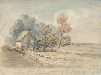 Ein strohgedecktes Cottage und Bäume an einer Landstraße